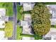 Aerial view of the community with homes, green lawns, and large trees at 540 Kelsey St, Lakeland, FL 33803