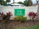 The Villas community sign with white fence and tropical landscaping at 540 Kelsey St, Lakeland, FL 33803