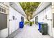 Side exterior of home with garbage cans, and small plant by the walkway at 540 Kelsey St, Lakeland, FL 33803