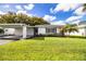 Charming single-story home with attached carport and lush green lawn at 540 Kelsey St, Lakeland, FL 33803
