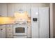 Well-equipped kitchen featuring white cabinetry, essential appliances, and ample counter space at 540 Kelsey St, Lakeland, FL 33803