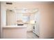 Functional kitchen with white cabinets, essential appliances, and convenient breakfast bar at 540 Kelsey St, Lakeland, FL 33803