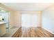 Spacious living room with wood-look floors and sliding glass doors at 540 Kelsey St, Lakeland, FL 33803