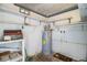 Utility room with water heater, shelves, and storage space at 540 Kelsey St, Lakeland, FL 33803