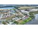 An aerial view of a Florida home nestled within a lakeside community at 561 Meandering Way, Polk City, FL 33868