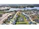 Elevated view of the property, showcasing the community and nearby lake at 561 Meandering Way, Polk City, FL 33868