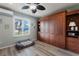 Bedroom with a murphy bed and built-in shelving at 561 Meandering Way, Polk City, FL 33868