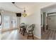 Breakfast nook with glass-top table and chairs, overlooking common area at 561 Meandering Way, Polk City, FL 33868