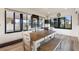 Dining area with table, chairs, and large windows at 561 Meandering Way, Polk City, FL 33868