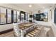Dining room with large windows, dining table, and chairs at 561 Meandering Way, Polk City, FL 33868
