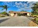 Attractive single-story home with paver driveway and covered entryway at 561 Meandering Way, Polk City, FL 33868