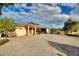 Paver driveway leads to a single-story home with a covered entryway at 561 Meandering Way, Polk City, FL 33868