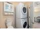 Laundry room with stacked washer and dryer at 561 Meandering Way, Polk City, FL 33868
