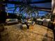 Spacious covered patio with outdoor kitchen, seating area, and ambient lighting at 561 Meandering Way, Polk City, FL 33868