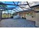 Covered patio area with a grill and pavers at 561 Meandering Way, Polk City, FL 33868
