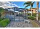 Screened-in patio with grill and sitting area at 561 Meandering Way, Polk City, FL 33868