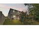 Backyard with playset and swing set at dusk at 585 Scott Lake Creek Ln, Lakeland, FL 33813