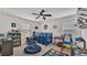 bedroom with bunk bed, desk, shelves, and lots of toys and books at 585 Scott Lake Creek Ln, Lakeland, FL 33813