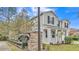 Two-story home with gray siding, white trim, and a landscaped front yard in Meadows at Scott Lake Creek at 585 Scott Lake Creek Ln, Lakeland, FL 33813