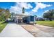 Covered carport with ample space for vehicles and boat storage at 6029 Avocado Dr, Indian Lake Estates, FL 33855