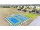 Aerial view of community tennis and pickleball courts at 6029 Avocado Dr, Indian Lake Estates, FL 33855