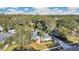 Aerial view of a single-Gathering home with a pool, surrounded by trees at 6818 Hayter Drive, Lakeland, FL 33813
