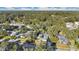 An aerial perspective of the house among the trees with a view of the neighborhood at 6818 Hayter Drive, Lakeland, FL 33813