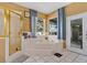 Bathroom featuring a jacuzzi tub, separate shower, and access to the outdoors at 6818 Hayter Drive, Lakeland, FL 33813
