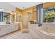 Spacious bathroom with double vanity, large shower, and jacuzzi tub at 6818 Hayter Drive, Lakeland, FL 33813