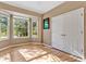 Bedroom with bay window, hardwood floors, and closet with double doors at 6818 Hayter Drive, Lakeland, FL 33813
