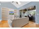 Comfortable living area with built-in entertainment center, ample natural light, and wood floors at 6818 Hayter Drive, Lakeland, FL 33813