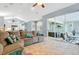 Living room with comfortable sectional sofa and sliding glass doors leading to the patio at 6818 Hayter Drive, Lakeland, FL 33813