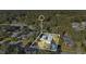 Arial view of home and surrounding lot nestled within a mature treed neighborhood at 6818 Hayter Drive, Lakeland, FL 33813