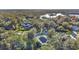 High-angle view of the surrounding neighborhood, showcasing tree-lined streets at 6818 Hayter Drive, Lakeland, FL 33813