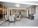 Covered patio with outdoor furniture, grill, and access to the pool area at 6818 Hayter Drive, Lakeland, FL 33813