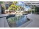 Inviting pool with a spa, surrounded by a screened enclosure, perfect for relaxation at 6818 Hayter Drive, Lakeland, FL 33813