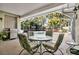 Covered patio with outdoor grill, dining area, and in-ground pool at 6818 Hayter Drive, Lakeland, FL 33813