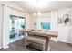 Dining area with a table, bench seating, and sliding glass doors leading to the outdoors at 770 Bentley North Loop, Auburndale, FL 33823