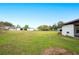 Large backyard with grassy area and storage shed at 1568 S Lake Shipp Dr, Winter Haven, FL 33880