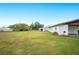 Large backyard with grassy area and storage shed at 1568 S Lake Shipp Dr, Winter Haven, FL 33880