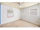 Empty bedroom with two windows and ceiling fan at 1568 S Lake Shipp Dr, Winter Haven, FL 33880