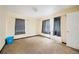 Simple bedroom with carpet and window at 1568 S Lake Shipp Dr, Winter Haven, FL 33880