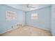 Light blue walls and ceiling fan in this bedroom at 1568 S Lake Shipp Dr, Winter Haven, FL 33880