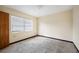 Simple bedroom with window, closet and carpeted floor at 1568 S Lake Shipp Dr, Winter Haven, FL 33880