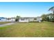 Ranch-style home with carport and spacious lawn at 1568 S Lake Shipp Dr, Winter Haven, FL 33880