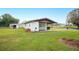 House exterior with carport and grassy yard at 1568 S Lake Shipp Dr, Winter Haven, FL 33880