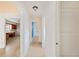 A long hallway with access to other rooms and kitchen at 1568 S Lake Shipp Dr, Winter Haven, FL 33880