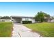 Front view of a single-story home with a carport at 1568 S Lake Shipp Dr, Winter Haven, FL 33880