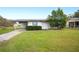 Single-story home with a carport and small front yard at 1568 S Lake Shipp Dr, Winter Haven, FL 33880
