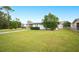 Front view of a single-story house with a grassy lawn at 1568 S Lake Shipp Dr, Winter Haven, FL 33880